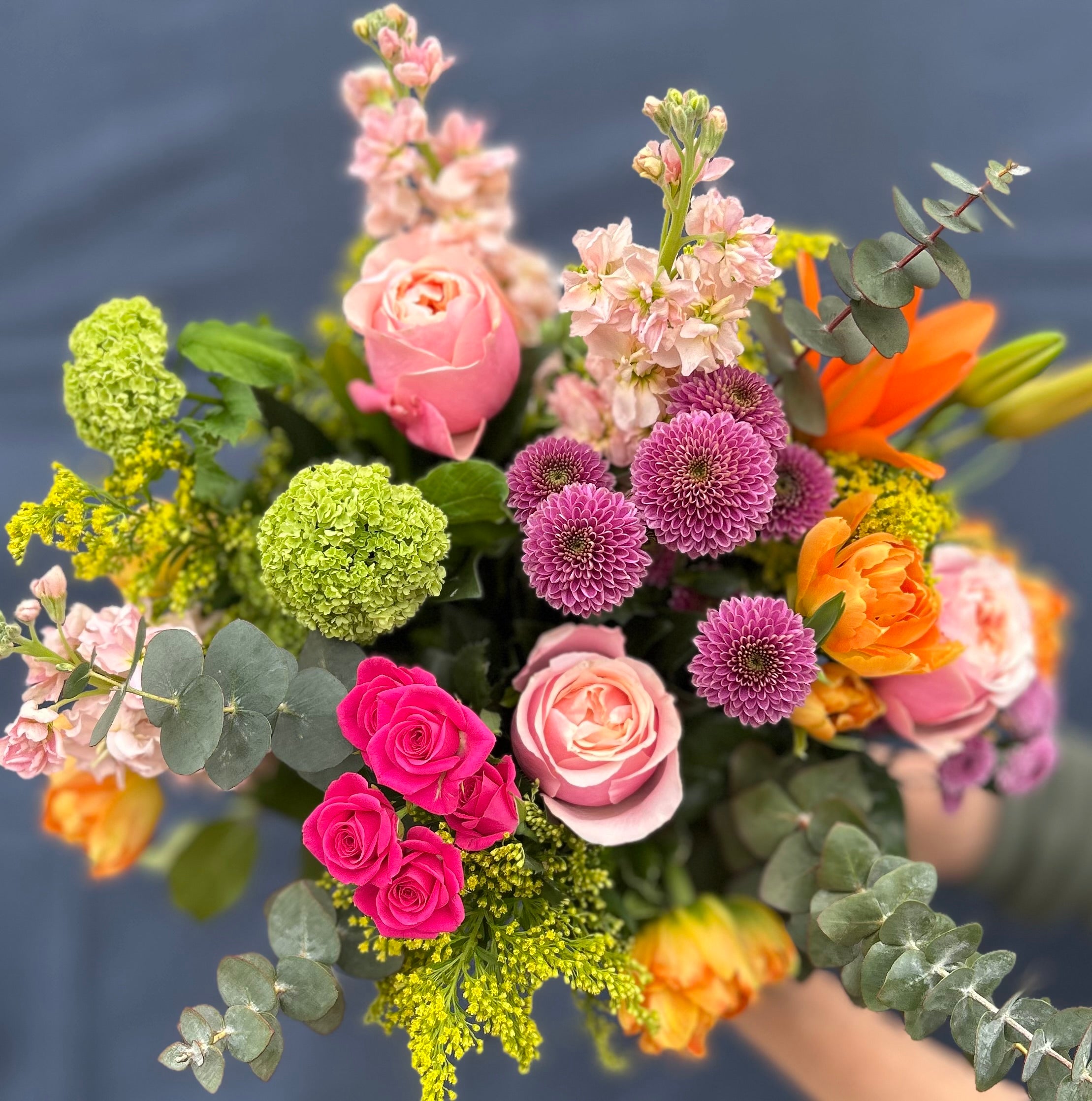 Image showcasing Bright and colorful hand tied arrangement $150 – Fleurish Flower Shop