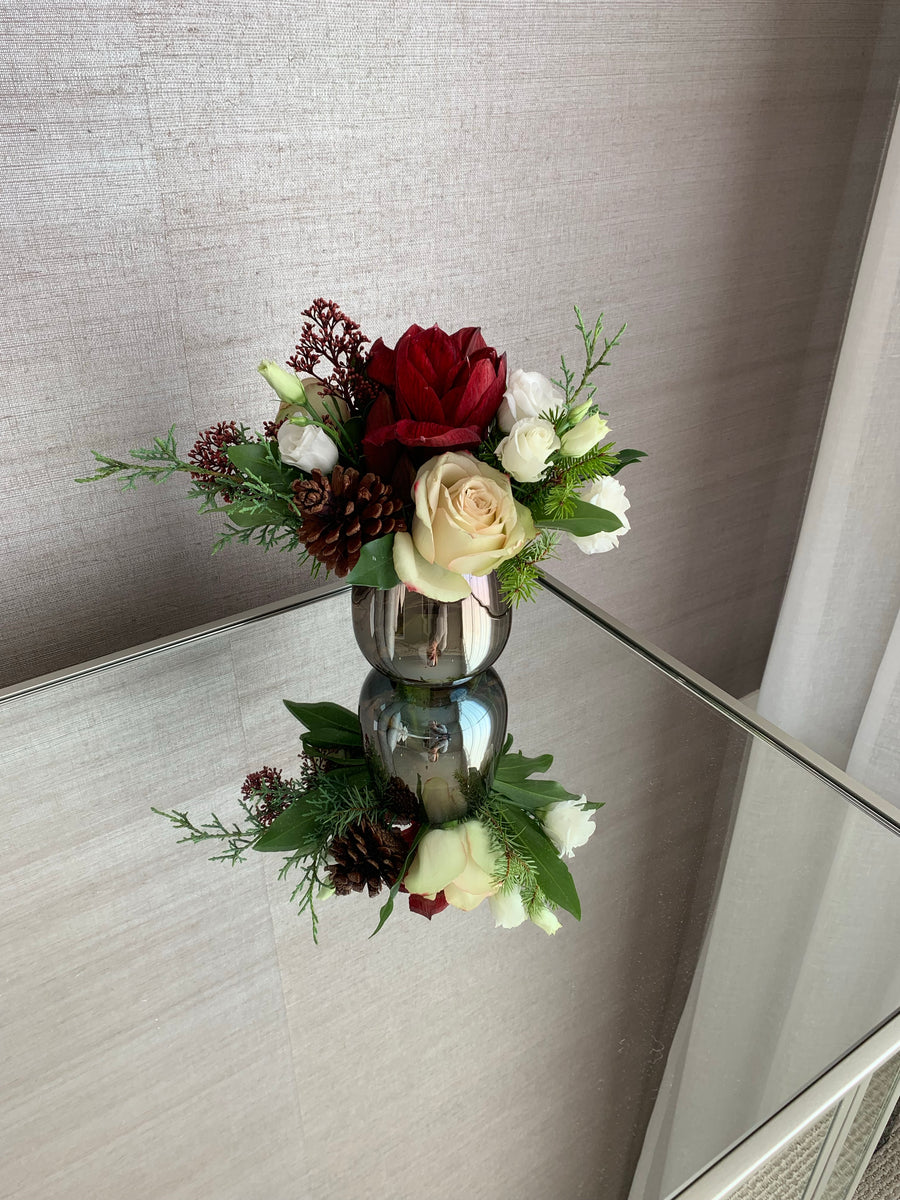 Winter arrangement in beautiful silver vase (container and flowers may vary but will maintain the style and design shown in photo)