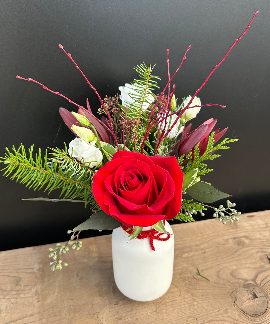 Small red and white florals in white vase