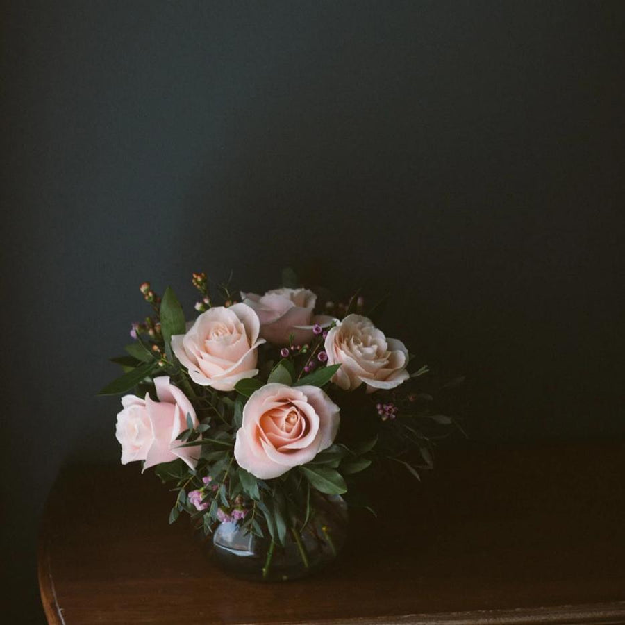 Half dozen pink roses in vase