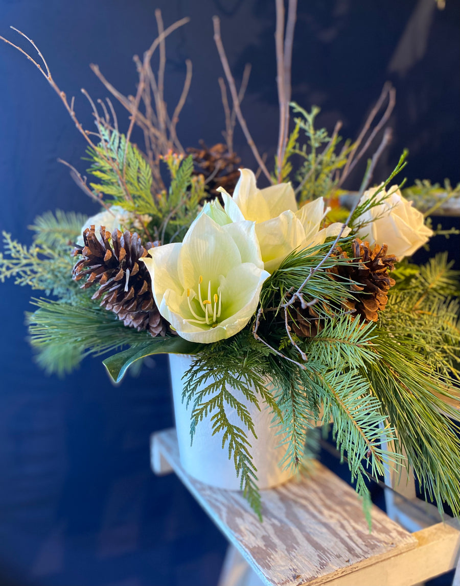 White and green natural vase with cones and twigs