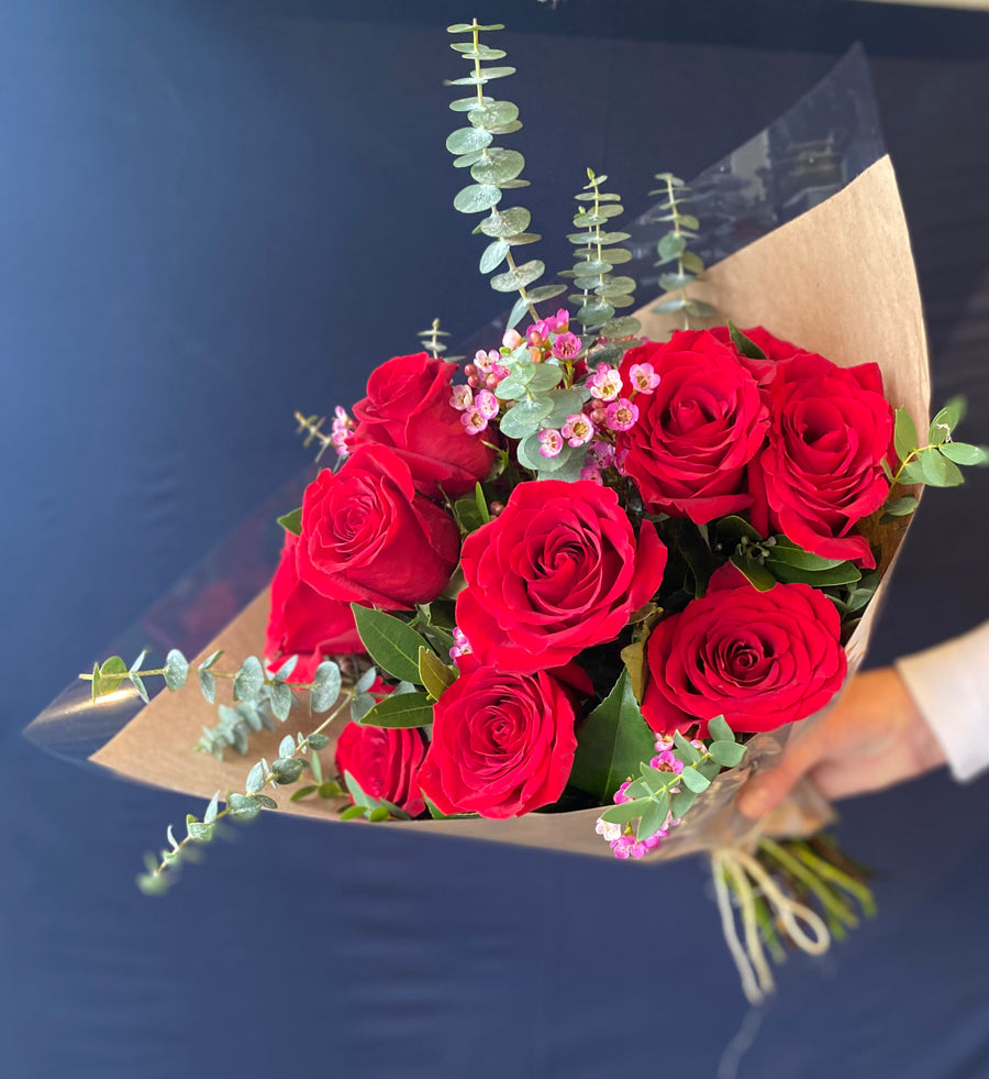 One dozen red roses -  hand tied bouquet